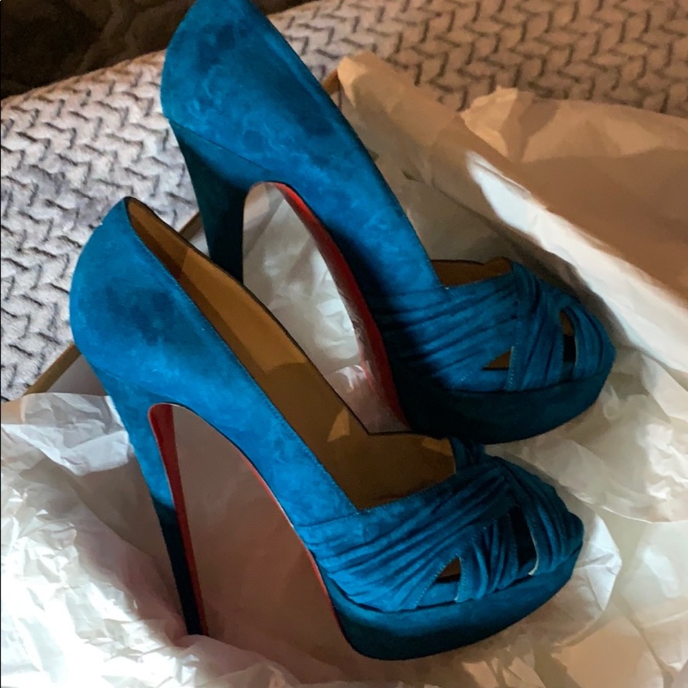 Gently used Christian Louboutin turquoise suede